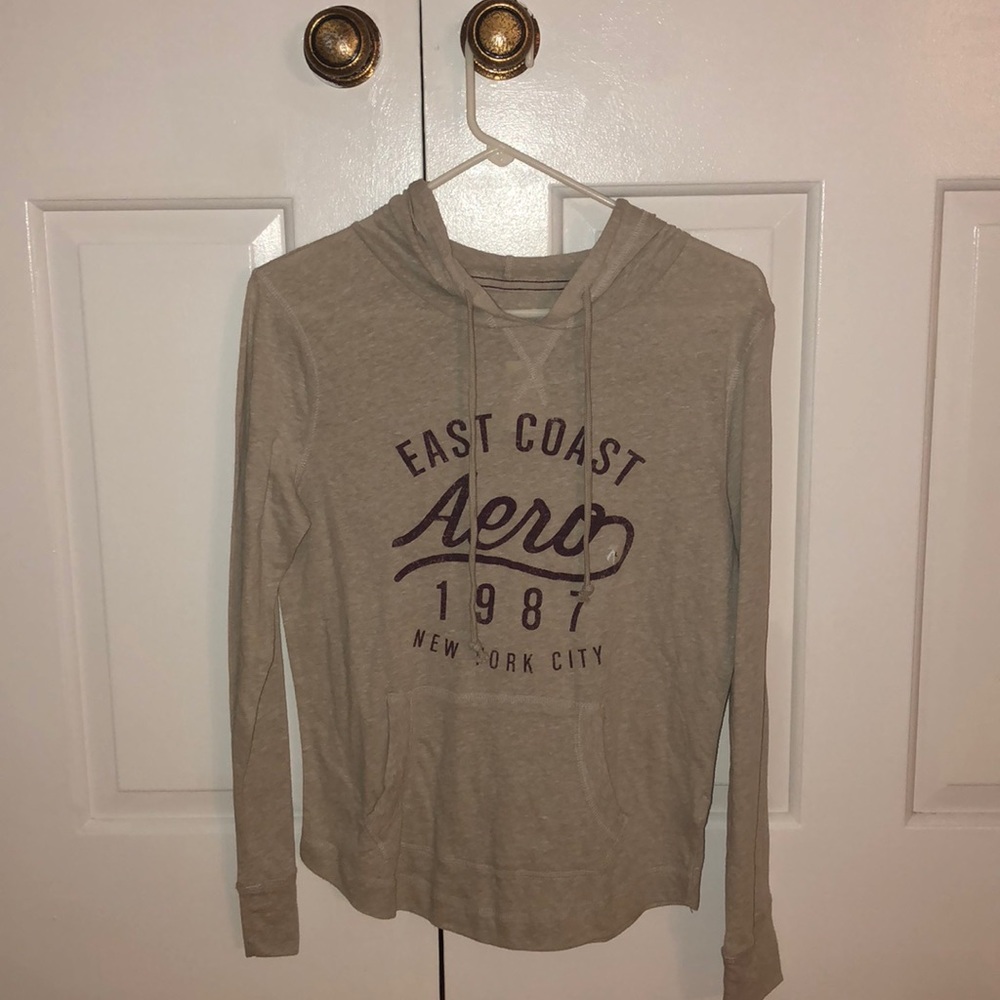cream colored light long-sleeve with hoodie